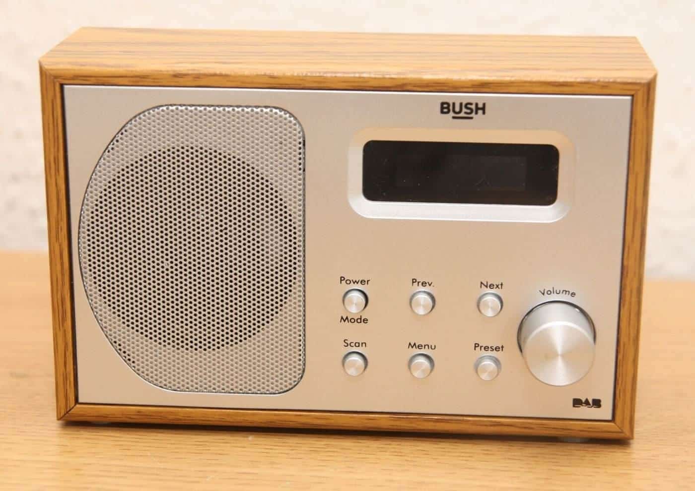 A wooden-style DAB digital radio on a table